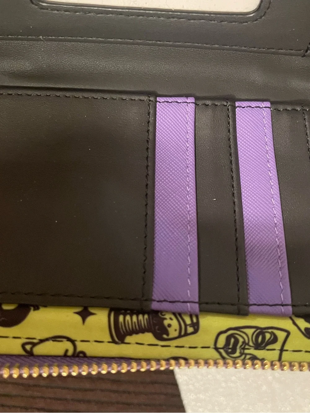 Disney Black Phone Wallet Case with Purple Trim and Neon Poison Apple